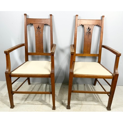 662 - SET OF SIX (FOUR PLUS TWO CARVERS) ARTS AND CRAFTS STYLE OAK DINING CHAIRS WHICH WE ARE ADVISED WERE... 