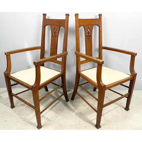 662 - SET OF SIX (FOUR PLUS TWO CARVERS) ARTS AND CRAFTS STYLE OAK DINING CHAIRS WHICH WE ARE ADVISED WERE... 