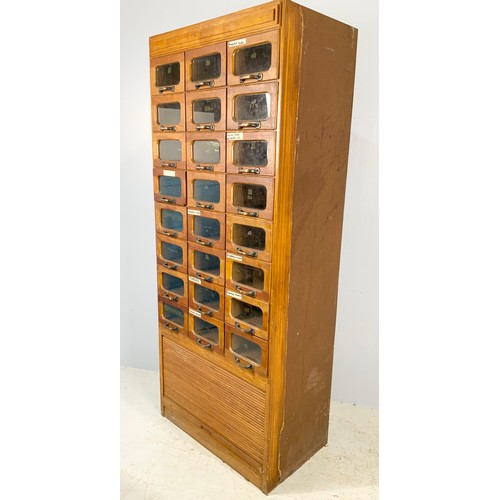 591 - VINTAGE HABERDASHERY CABINET – MID 20TH CENTURY OAK WITH GLASS FRONTED DRAWERS ABOVE A TAMBOUR FRONT... 