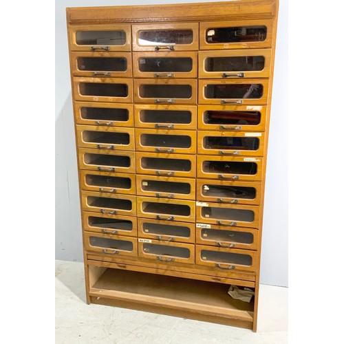 590 - VINTAGE HABERDASHERY CABINET – MID 20TH CENTURY OAK WITH GLASS FRONTED DRAWERS ABOVE A TAMBOUR FRONT... 