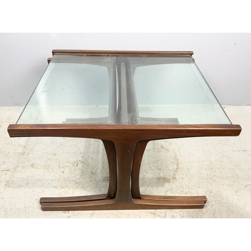 636 - NEST OF THREE LATE CENTURY TEAK AND GLASS TOP TABLES