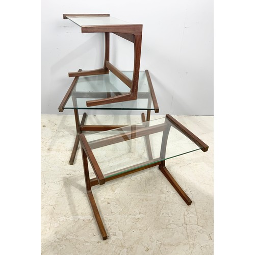 636 - NEST OF THREE LATE CENTURY TEAK AND GLASS TOP TABLES