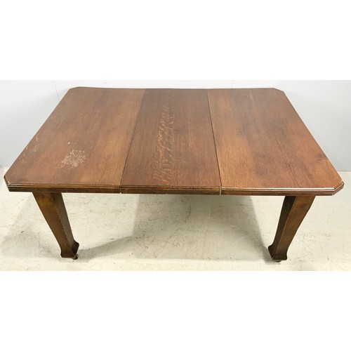 552 - ARTS AND CRAFTS STYLE OAK DINING  TABLE WITH A LEAVE  145cm x 104cm  WHICH WE ARE ADVISED WERE PURCH... 