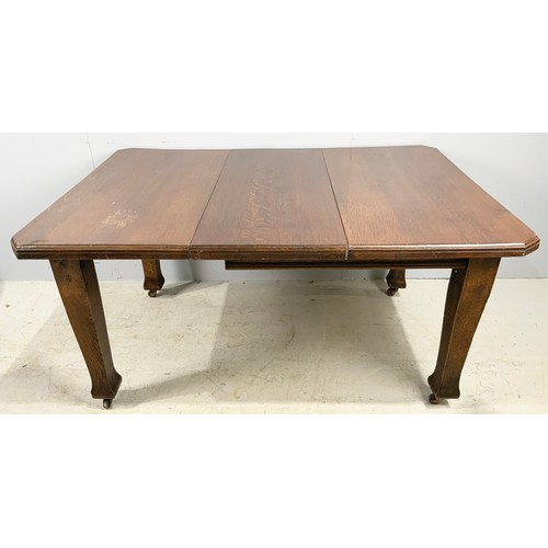 552 - ARTS AND CRAFTS STYLE OAK DINING  TABLE WITH A LEAVE  145cm x 104cm  WHICH WE ARE ADVISED WERE PURCH... 