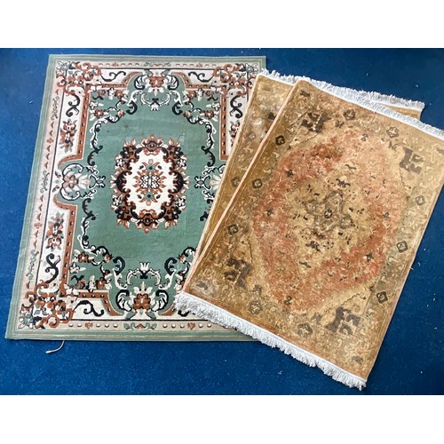 676 - 3 PERSIAN STYLE MACHINE MADE RUGS. ONE GREEN, 2 IDENTICAL BEIGE/GOLD GROUND.  ALL WITH CENTRAL MEDAL... 