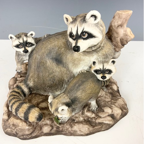 154 - BOEHM PORCELAIN MODEL OF  A RACCOON WITH CUBS AND A ZEBRA