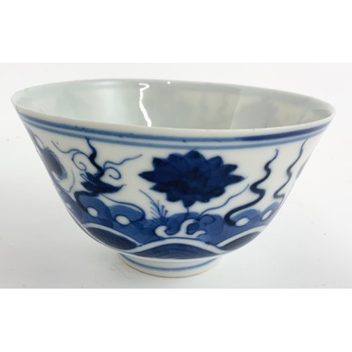 235 - THREE ORIENTAL BLUE AND WHITE TEA BOWLS EACH WITH A SIX CHARACTER MARK TOGETHER WITH A RICE BOWL