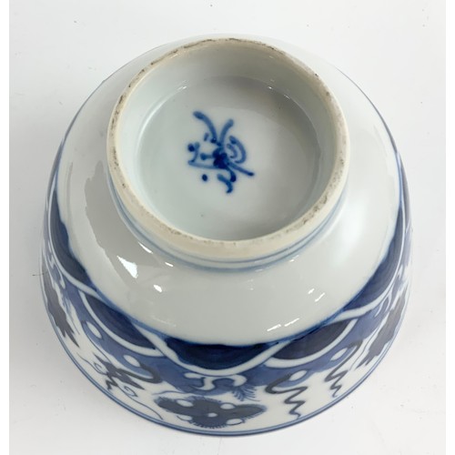 235 - THREE ORIENTAL BLUE AND WHITE TEA BOWLS EACH WITH A SIX CHARACTER MARK TOGETHER WITH A RICE BOWL