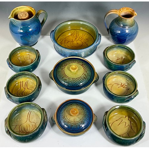 257 - SYLVIE DURIEZ BLUE GLAZED SOUP BOWLS, SERVING DISHES AND PITCHERS