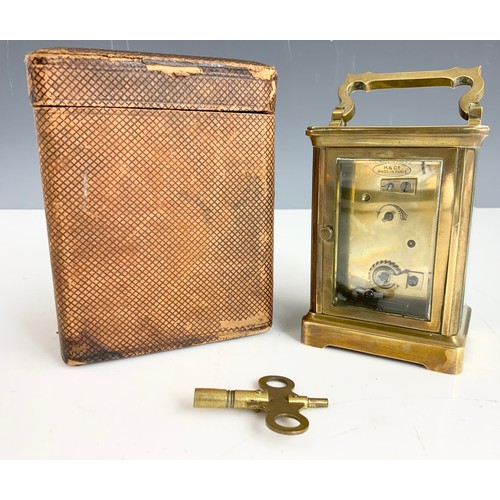 300 - A FRENCH BRASS CARRIAGE CLOCK WITH TRAVEL CASE STAMPED R & CO MADE IN PARIS