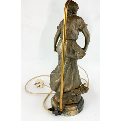 309 - SPELTER TABLE LAMP DEPICTING LADY WITH BASKET