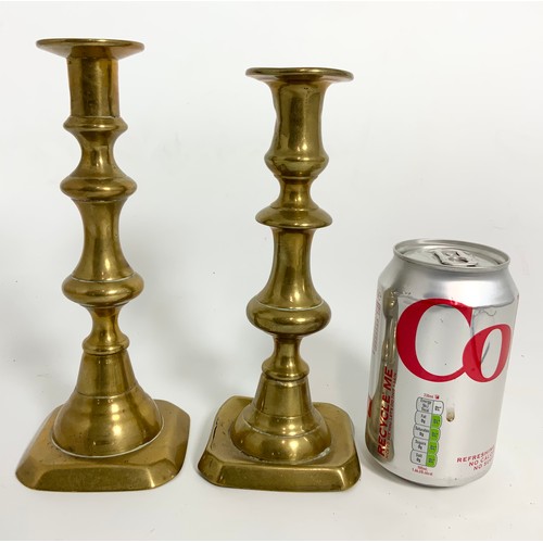 357 - SMALL LOADED SILVER CANDLESTICK AND A TWO OF BRASS DITTO