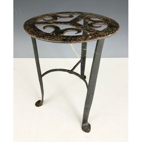 366 - CAST IRON TRIVET 30cm TALL  AND A  PAIR OF CAST IRON DOOR PORTERS