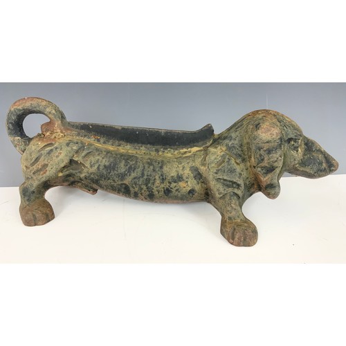 368 - CAST METAL PAW DOOR PORTER, A CAST DACHSHUND BOOT SCRAPPER, WITH A FLAT IRON & STAND