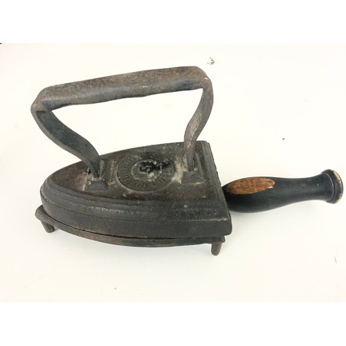 368 - CAST METAL PAW DOOR PORTER, A CAST DACHSHUND BOOT SCRAPPER, WITH A FLAT IRON & STAND