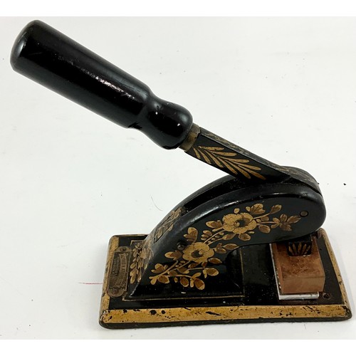 384 - A VICTORIAN BLACK PAINTED AND FLORAL GILDED ADDRESS STAMP