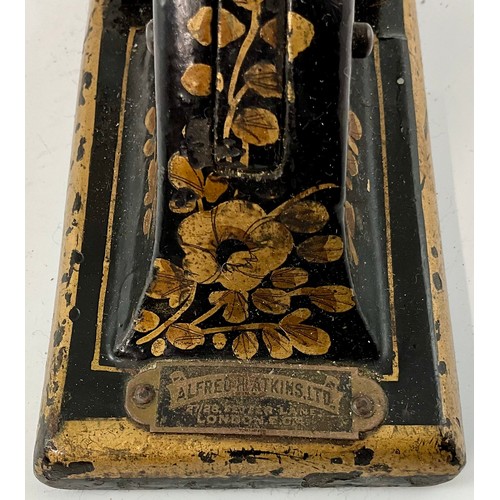 384 - A VICTORIAN BLACK PAINTED AND FLORAL GILDED ADDRESS STAMP