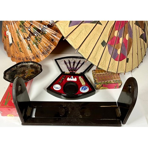 410 - ORIENTAL COLLECTABLES INC. TWO PARASOLS, SLIDING BOOK SHELF, COASTERS AND BOXED WATERCOLOUR PAINTING... 