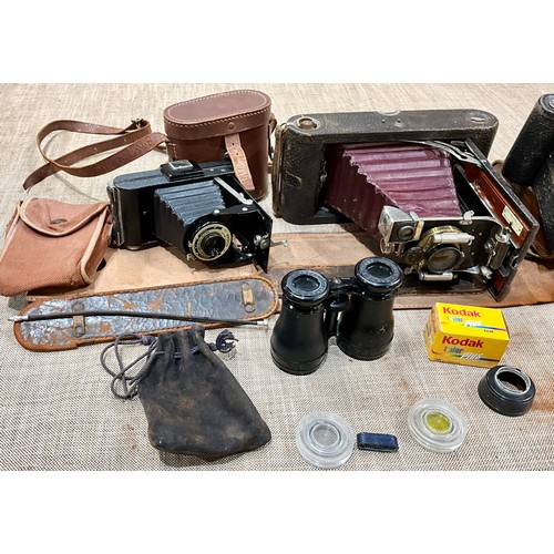 450 - THREE VINTAGE KODAK CAMERAS TOGETHER WITH A PAIR OF FRENCH BINOCULARS