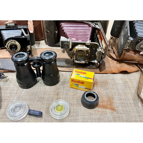 450 - THREE VINTAGE KODAK CAMERAS TOGETHER WITH A PAIR OF FRENCH BINOCULARS