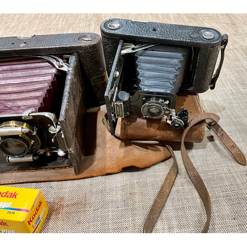 450 - THREE VINTAGE KODAK CAMERAS TOGETHER WITH A PAIR OF FRENCH BINOCULARS