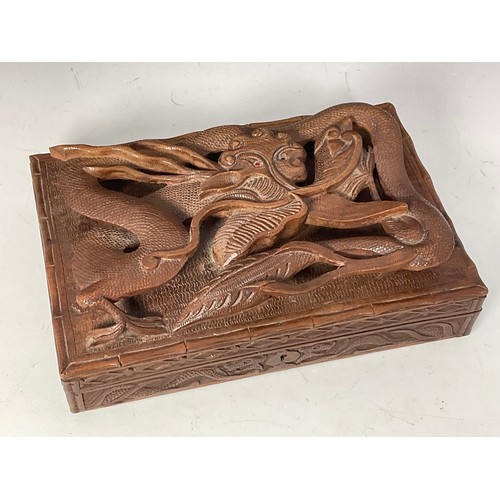 387 - A LATE 19TH CENTURY EASTERN CARVED WOODEN BOX, THE TOP CARVED WITH A DRAGON, approx. 30 cm