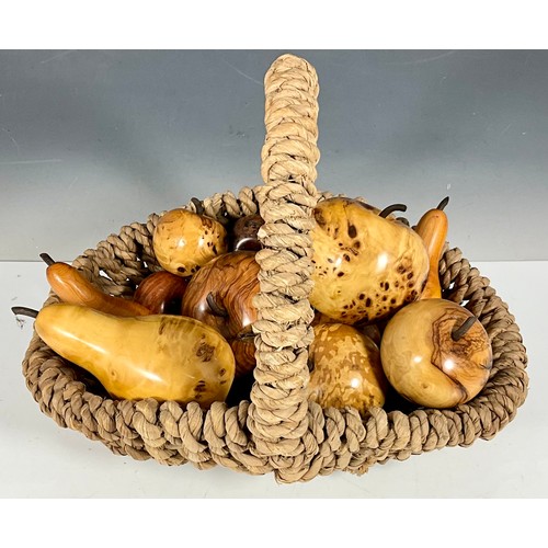 388 - BASKET CONTAINING CARVED FRUITS IN A VARIETY OF DIFFERENT WOODS