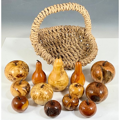 388 - BASKET CONTAINING CARVED FRUITS IN A VARIETY OF DIFFERENT WOODS