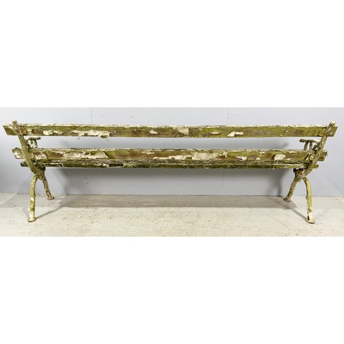 555 - WOODEN BENCH WITH CAST IRON STYLISED BRANCH WINGS WIDTH 242cm