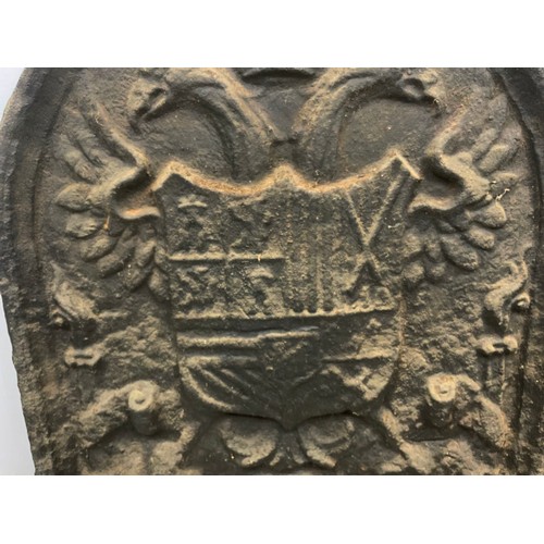 548 - CAST IRON HERALDIC FIREBACK  WIDTH 45 , 54cm TALL WITH A LATER BLACKSMITH MADE FIRE BASKET WITH FIRE... 