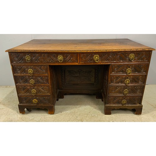 628 - CARVED OAK GOTHIC STYLE KNEE HOLE DESK