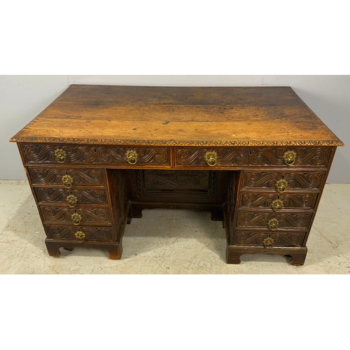 628 - CARVED OAK GOTHIC STYLE KNEE HOLE DESK