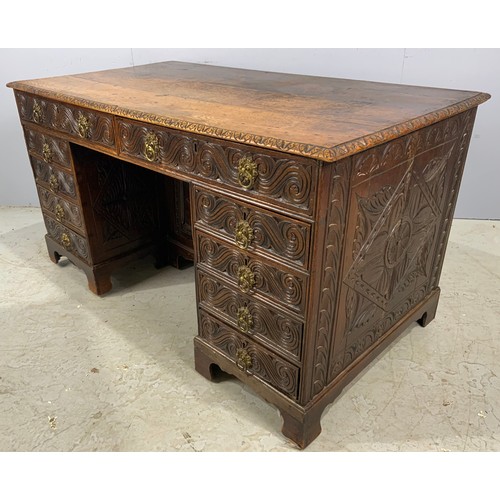 628 - CARVED OAK GOTHIC STYLE KNEE HOLE DESK