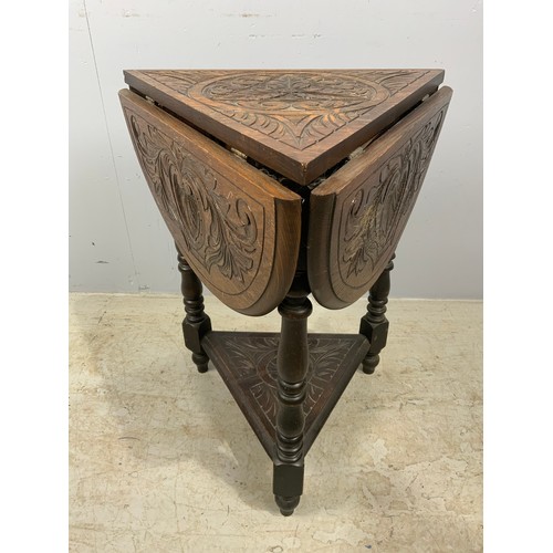 624 - CARVED OAK DROP FLAP TRIANGULAR TABLE