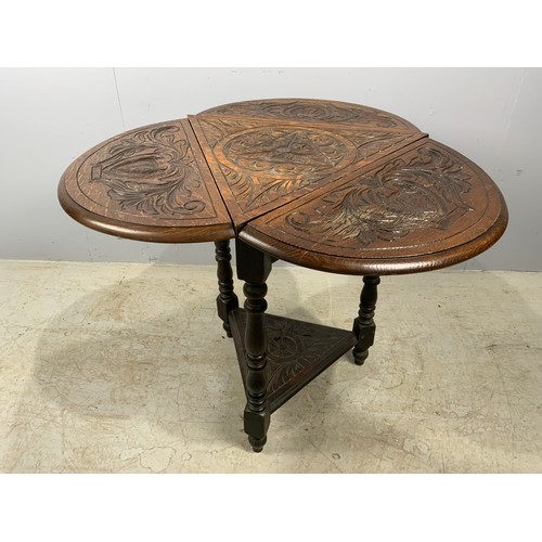 624 - CARVED OAK DROP FLAP TRIANGULAR TABLE