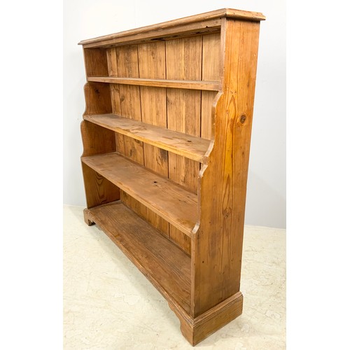 630 - PINE WATERFALL BOOKCASE ON BRACKET FEET WIDTH 123cm