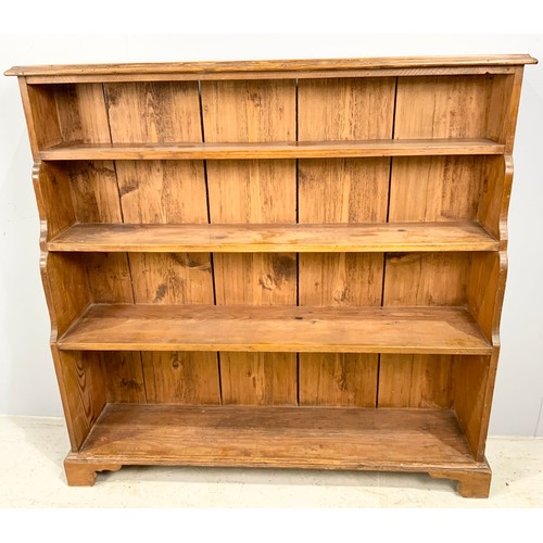 630 - PINE WATERFALL BOOKCASE ON BRACKET FEET WIDTH 123cm