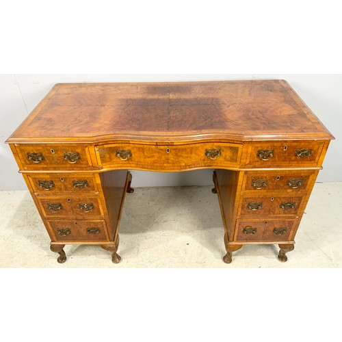 657 - WALNUT VENEER SERPENTINE FRONT TWIN PEDESTAL DESK 118cm x 56cm