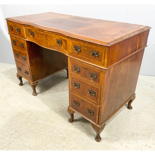 657 - WALNUT VENEER SERPENTINE FRONT TWIN PEDESTAL DESK 118cm x 56cm