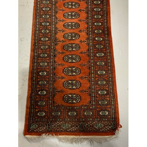 726 - HAND KNOTTED TRADITIONAL PERSIAN RUST COLOURED BOKHARA RUNNER APPROX 63X318CM