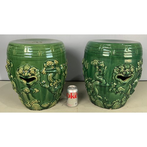 175 - PAIR OF ORIENTAL CERAMIC STOOLS / SEATS  WITH EMBOSED DRAGON DECORATION IN A GREEN GLAZE 38cm TALL