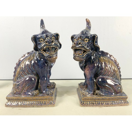 167 - PAIR OF PURPLE GLAZED ORIENTAL LION DOGS  33cm TALL