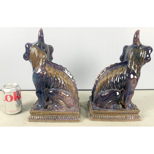 167 - PAIR OF PURPLE GLAZED ORIENTAL LION DOGS  33cm TALL