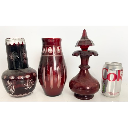 217 - QUANTITY OF BOHEMIAN FLASHED RUBY GLASS INC VASES , DECANTERS TALLEST 41cm