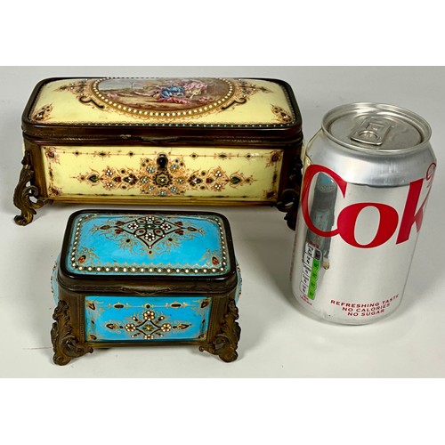 174 - 2 DECORATIVE CERAMIC CIGARETTE BOXES EACH EMBELLISHED WITH BEADING AND WITH ORNAMENTAL FEET, POSSIBL... 