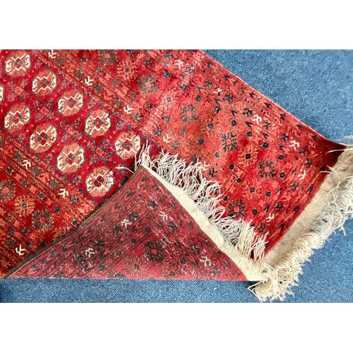 742 - LARGE RED GROUND RUG Approx. 252 x 141cm, SMALLER RUG Approx. 156 x 115cm AND TURKOMAN STYLE RED GRO... 