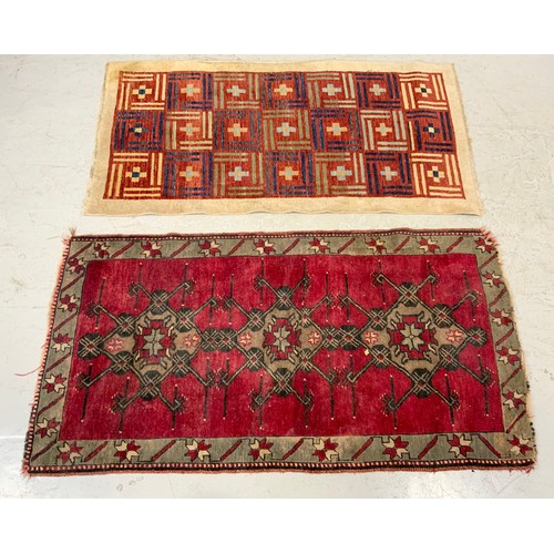 743 - TWO RED GROUND RUGS LARGEST 198cm x 102cm