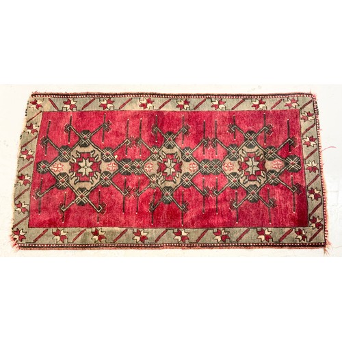 743 - TWO RED GROUND RUGS LARGEST 198cm x 102cm