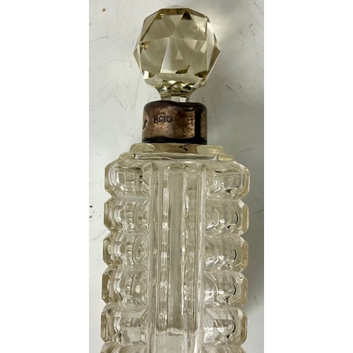 236 - THREE CUT GLASS PERFUME BOTTLES WITH SILVER COLLARS AND A SILVER TOP DRESSING TABLE POT