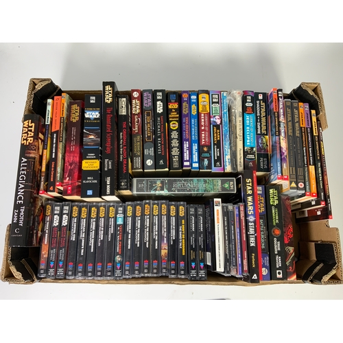 310 - TRAY OF STAR WARS RELATED BOOKS, DVD’S, CASSETTE TAPES, GOOD VARIED SELECTION.